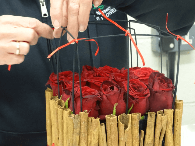 For further decoration for your table centrepiece, add midelino sticks creating a criss-cross pattern by simply bending the sticks at a right angle.